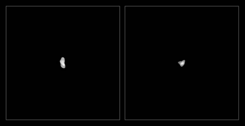 Two small gray objects lying on a black background.