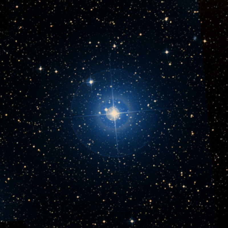 Bright blue-white star with other stars in background.