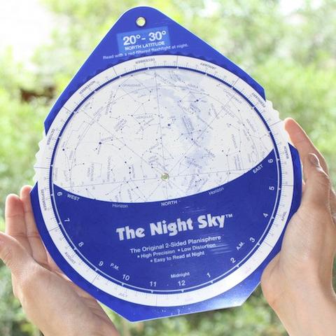 Blue and white disk with stars and constellations printed on it.