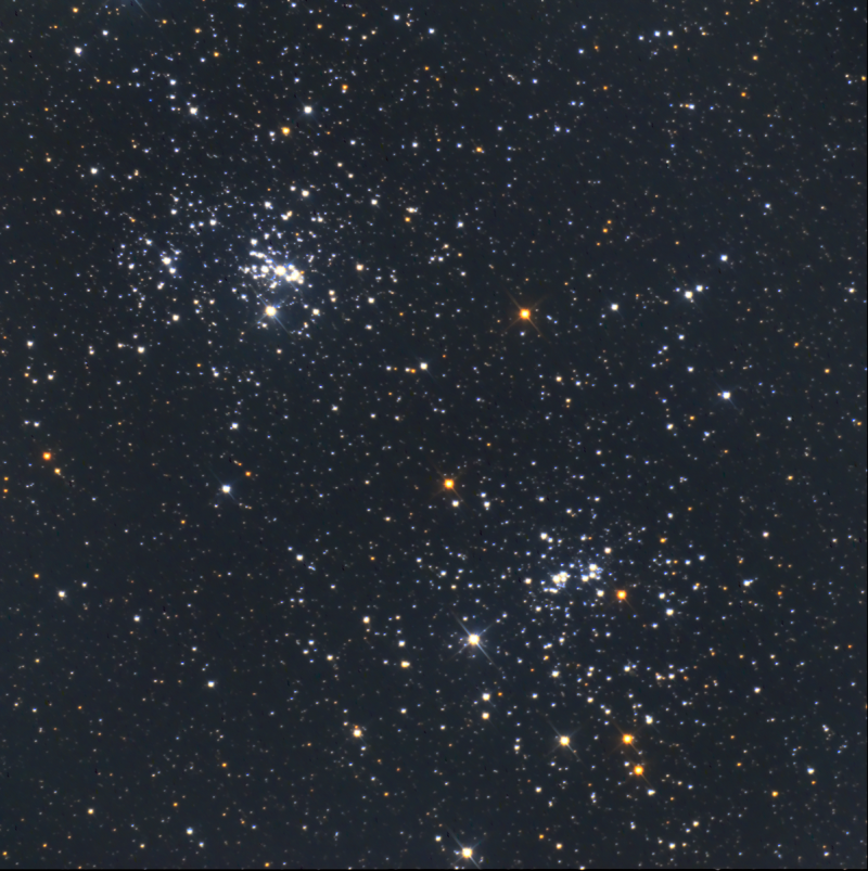 November deep sky: Two clusters of white dots of light with some red sprinkled in.