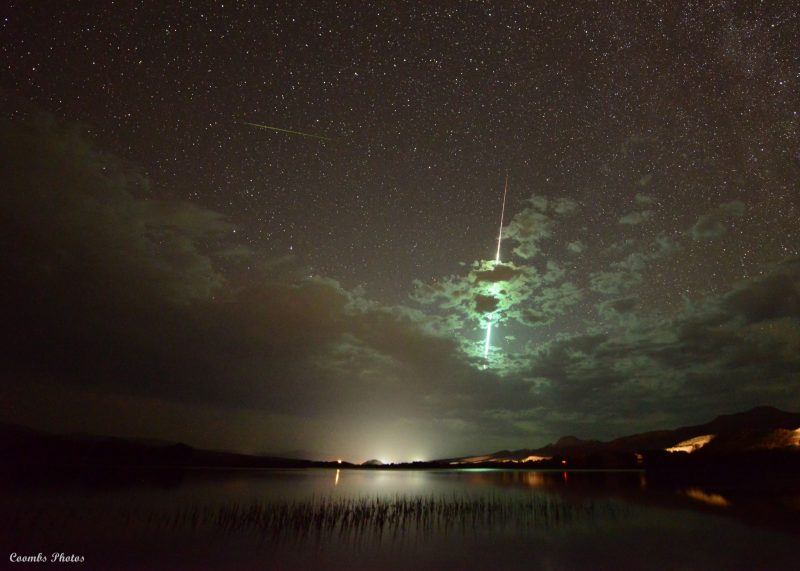 Top photos from 2021: Greenish meteor streaks downward behind sparse clouds.