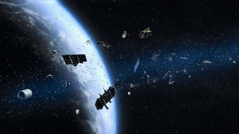 Kessler syndrome: Space view of satellites and debris in thick ring around Earth.