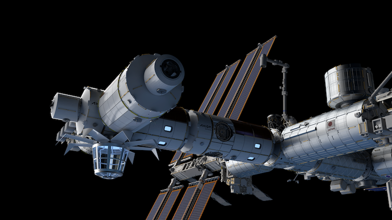 Two large white cylinders attached to a larger white mechanical outpost, floating in black space.