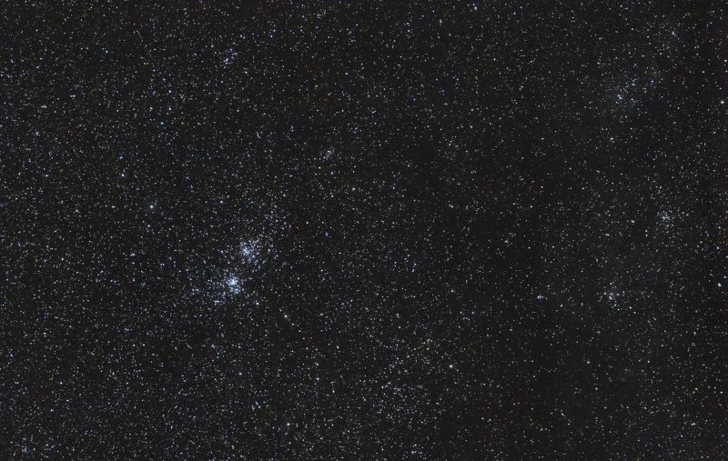 Starry black sky with two clusters at left side.