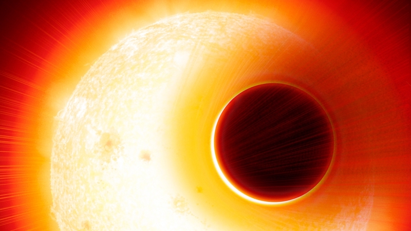 Exoplanet HAT-P-11b is depicted here in front of its bright host star. The side closer to the star is yellow and the opposite side is black.