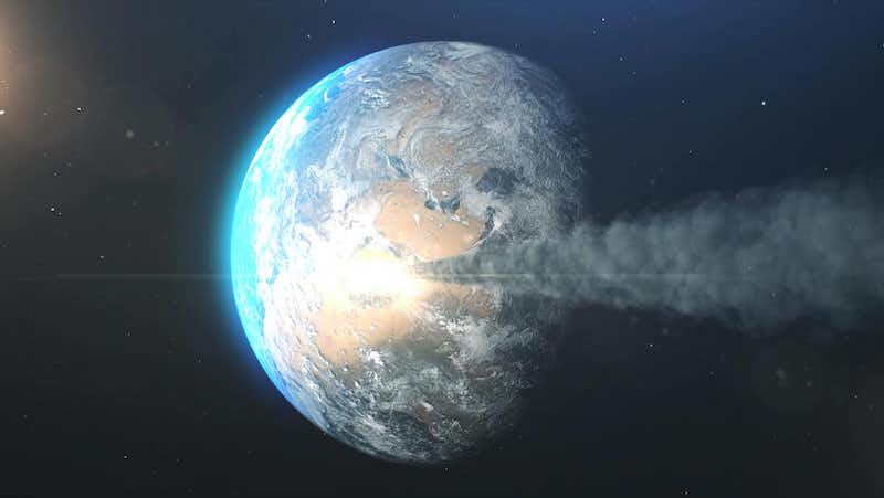 Planet being hit by large asteroid with a long smoke trail.