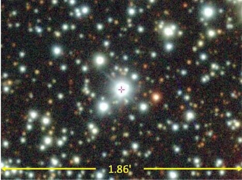 Dense star field with one large, bright star with crosshair mark.