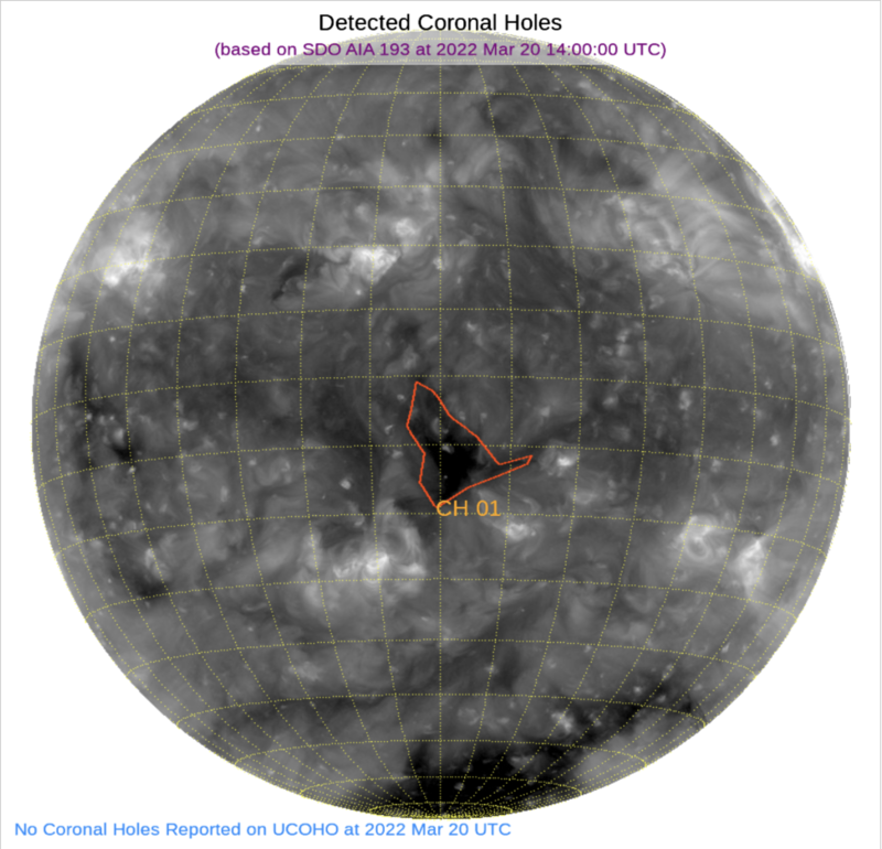 Gray blotchy sphere with gridlines and labeled black splotch outlined in red.