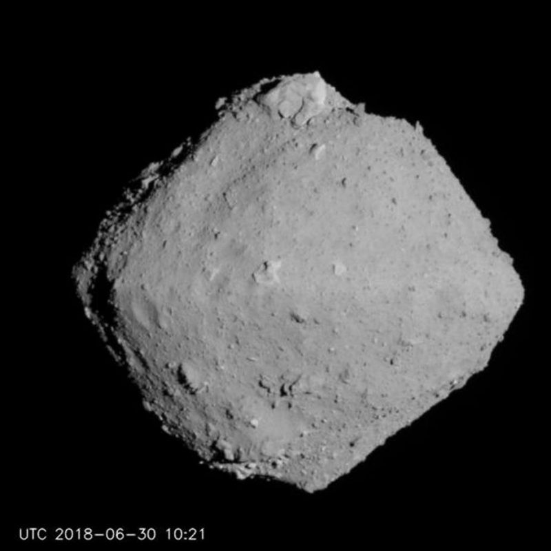 Asteroid Ryugu: Roughly diamond-shaped rocky asteroid in space.