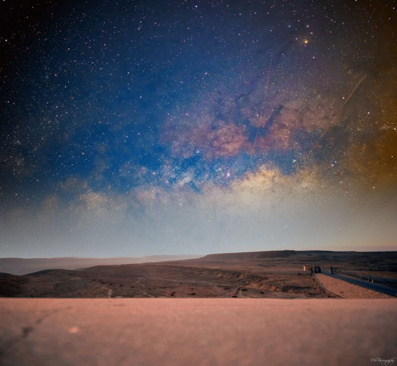 A stretch of sand below, and the Milky Way stretched out above.