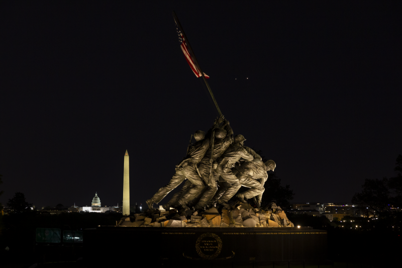 The Iwo Jima US Marine Monument in early dawn with two bright planets behind.
