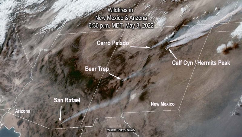 Orbital view of brown, mountainous land with streaks of white smoke streaming from labeled fire locations.