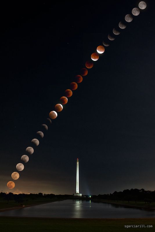 Lunar eclipse photos: Line of 26 transitioning moons on a black background over a tall white obelisk monument.