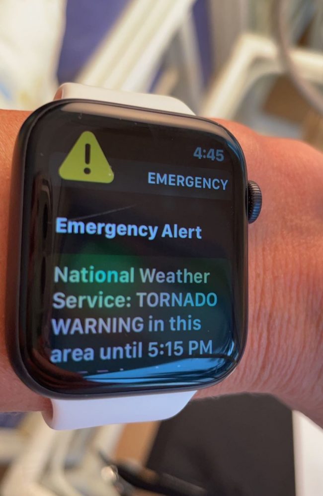 Apple watch screen with emergency alert message.