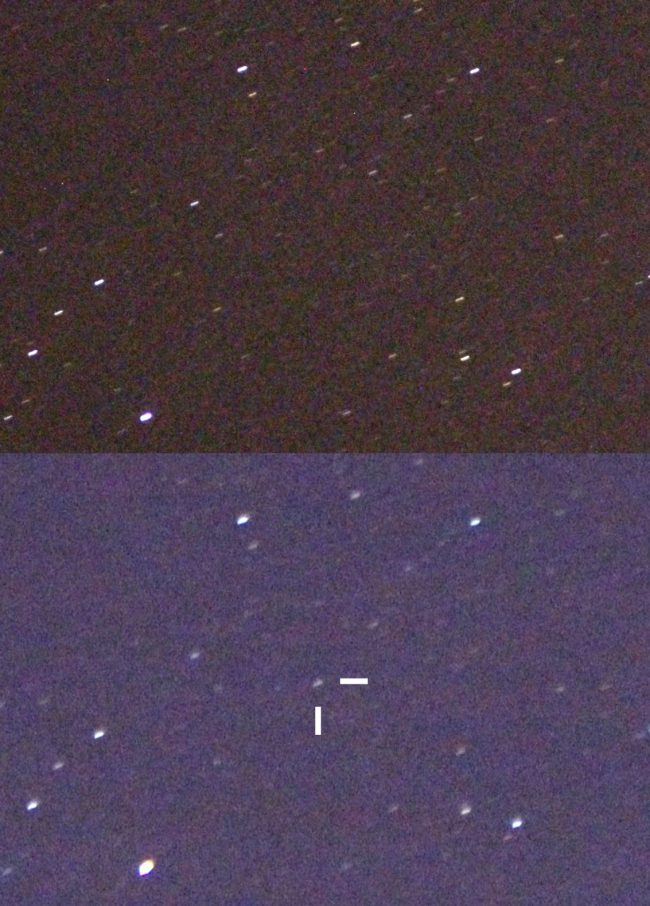 Faint star with tick marks among a few sparse background stars.