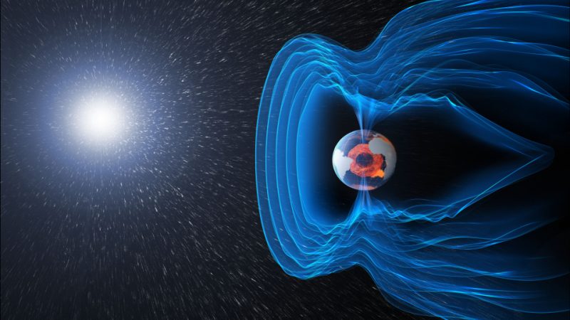 Cambio de polo magnético: el Sol a la izquierda y la Tierra con líneas azules paralelas a su alrededor que se sumergen hacia la superficie en los polos.
