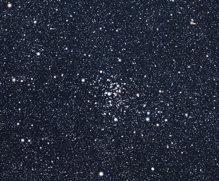 Campo de estrellas con un grupo de puntos blancos cerca del centro.