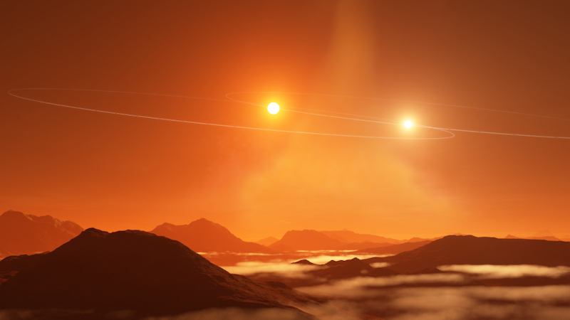 Binary-star planets: Two stars setting over hills on a foreign world, in orange hues.