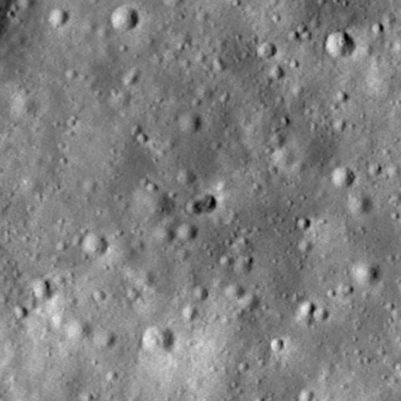 Rocky surface with 2 craters in the center.