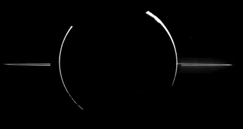 2 curved white arcs clasping a black circle with thin, oblique rings on left and right, on black background.