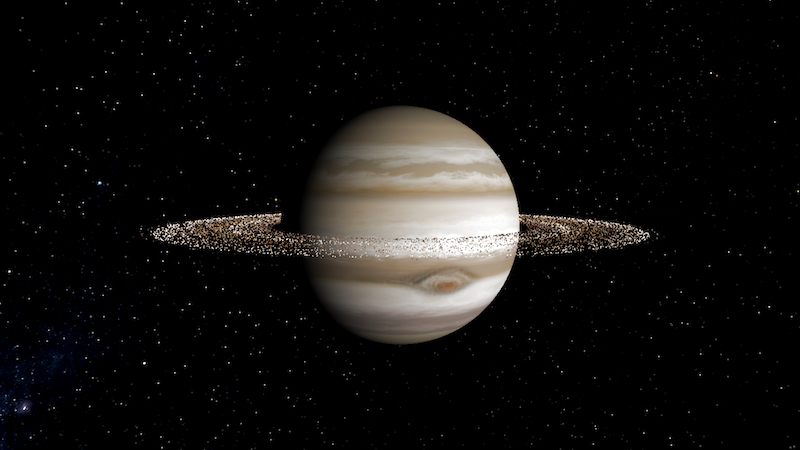 Planet with banded clouds, a large spot and rings made of very many tiny dots.