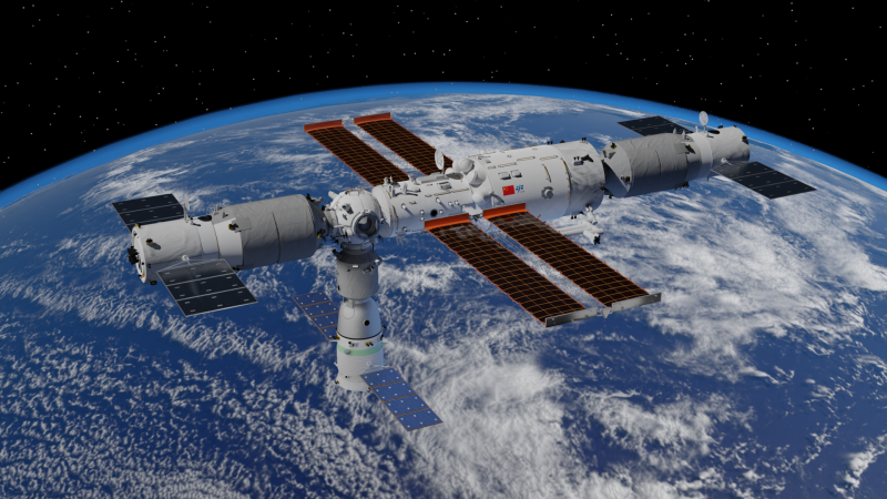 Cylindrical space station with panels on the sides over planet with blue water and white clouds.