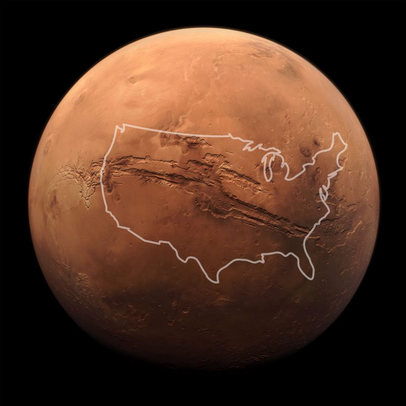 Image of Mars and huge gash of a canyon with outline of US over top.