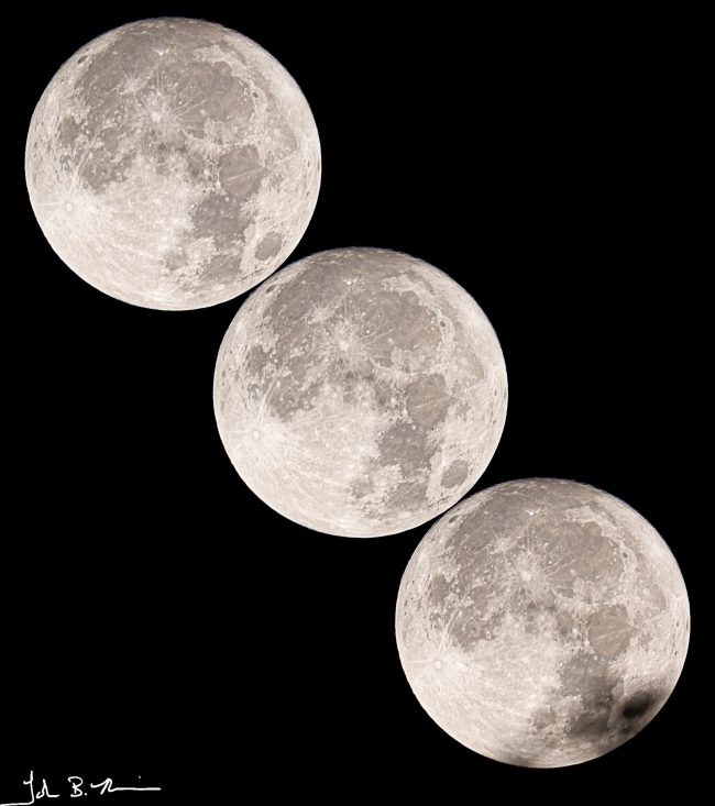 Three large, bright full moons in a diagonal line.