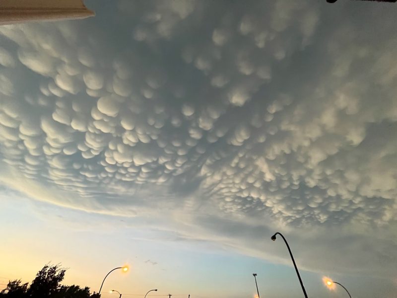 Mammatus clouds: Low-hanging clouds with large rounded bumps hanging down.