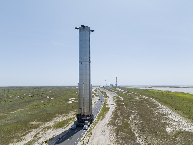 SpaceX: Silver cylinder on road.