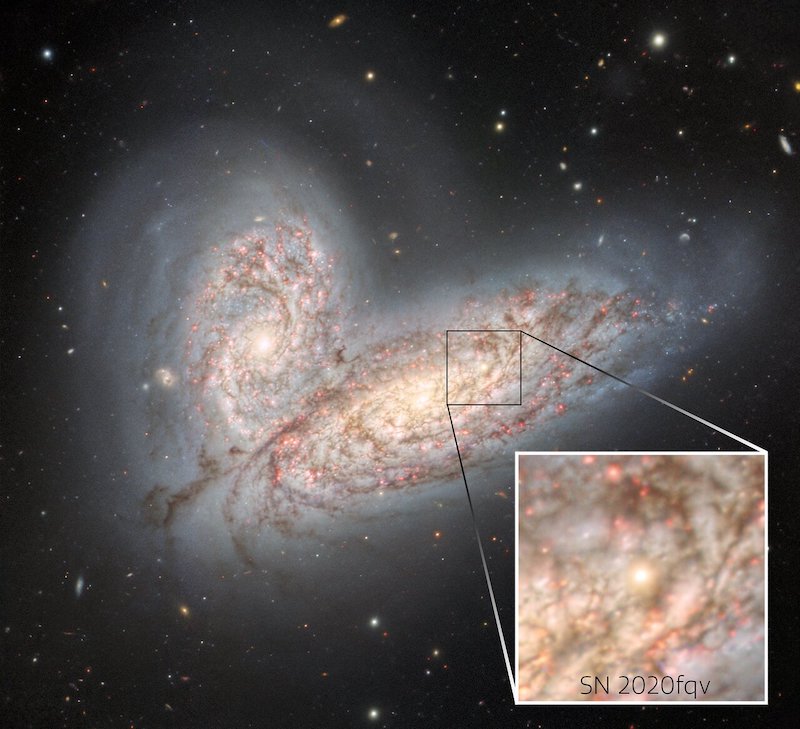 Two galaxies merging, with inset square with noticeable white dot.