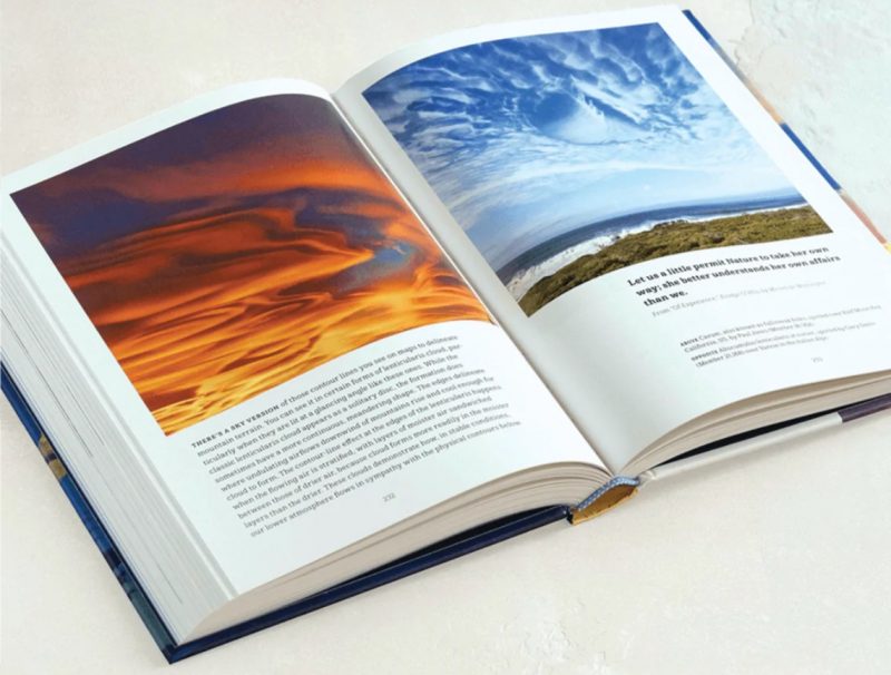 Open book showing orangish lenticular clouds and a hole punched through a cloud layer, with text.