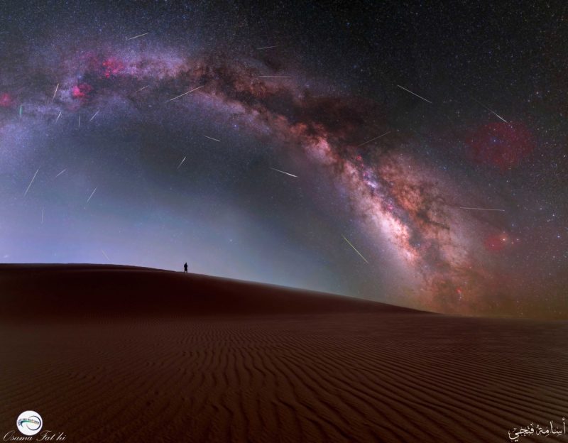 Arching Milky Way with lots of thin, bright meteor streaks.