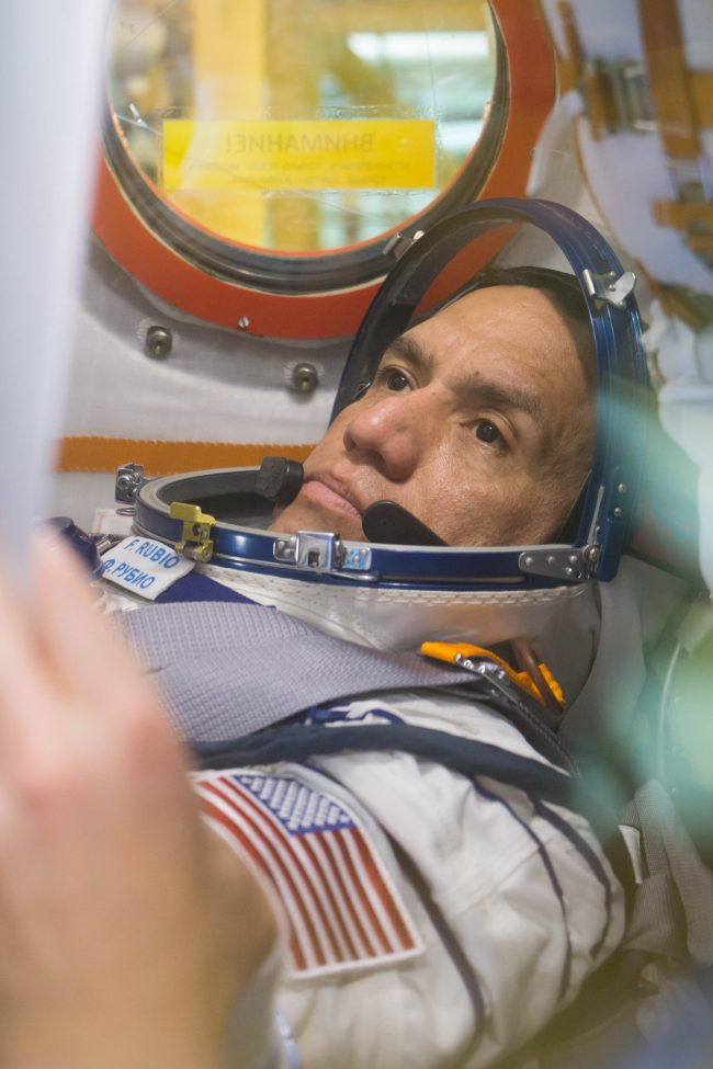 Close-up of a man with his astronaut suit on.