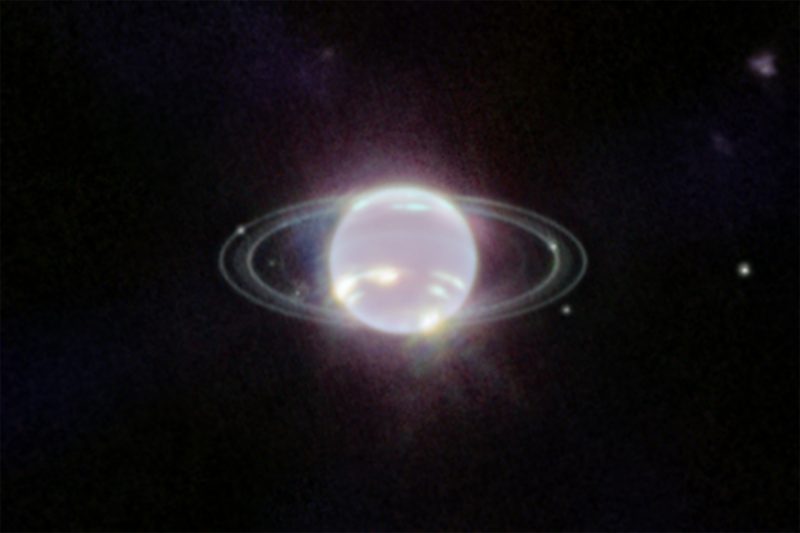 Neptune's rings: Glowing orb with hot spots and a couple of thin rings.