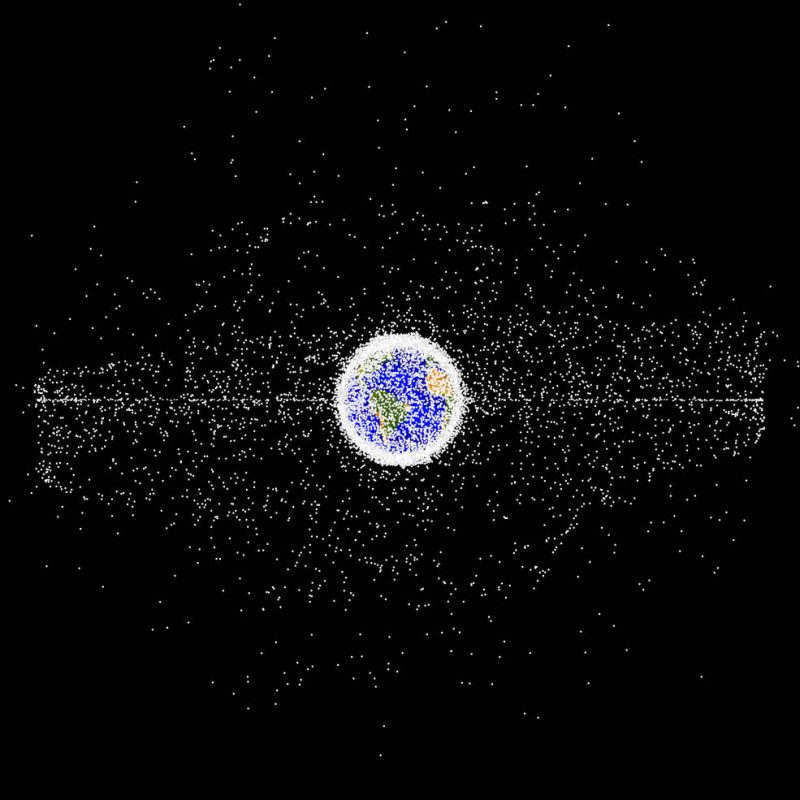Graphic depicting Earth with many, many dots around it representing orbital debris.