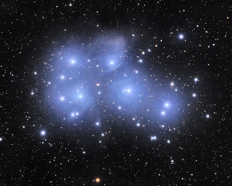 A dozen bright stars surrounded by wispy, intense blue clouds and background stars.