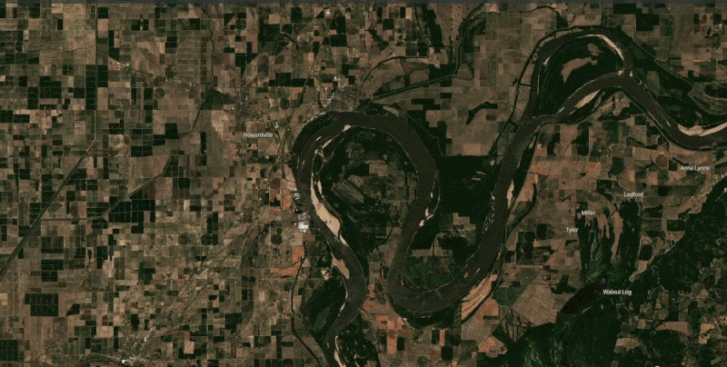 Moving image showing greener ground and wider Mississippi River to brown ground and sandbars.