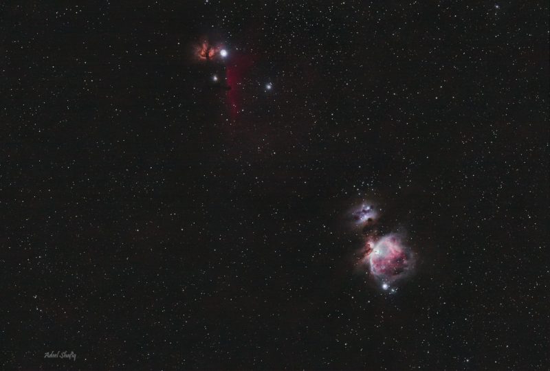 Multiple patches of small, reddish clouds, with numerous background stars.