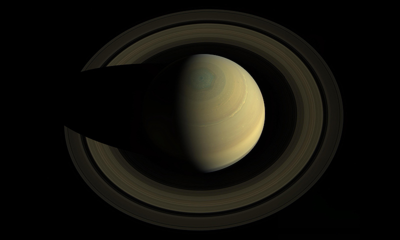 Secrets of Saturn's rings: Giant gas planet with rings seen from above.