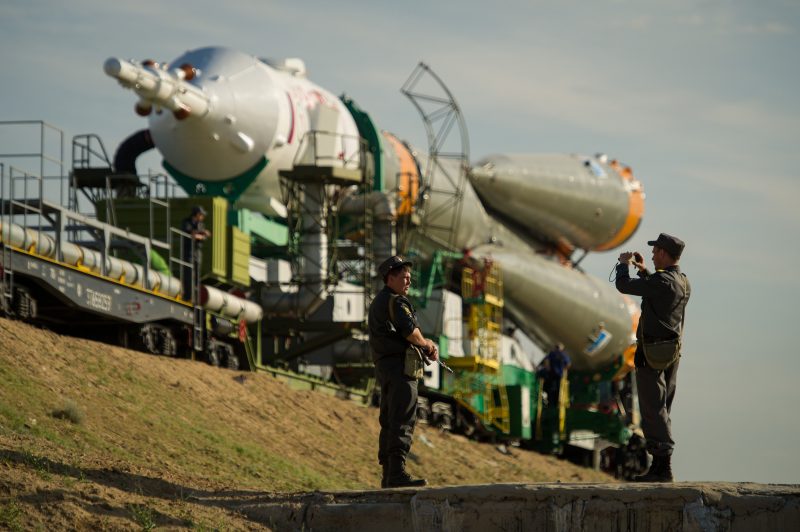 Russia: Soldiers taking photo of spacecraft being moved to the launch pad.