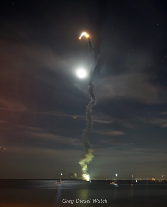 Plume of smoke leading to fiery trail above where Artemis is.