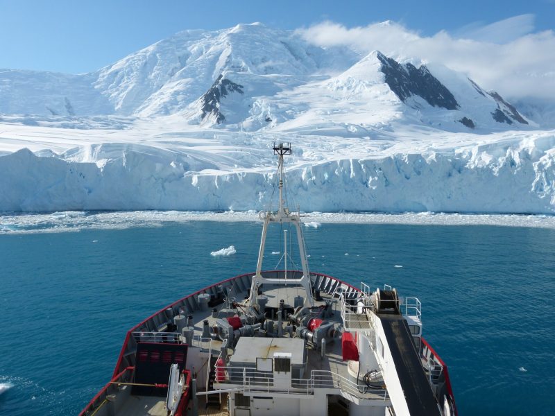 Glacier calving in Antarctica: View of Antarctic glacier from the front of a ship.
