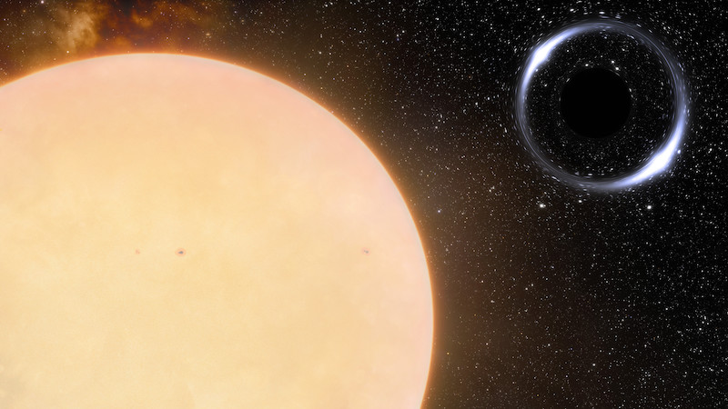 Reflective bubble-like object close to a star, with other stars in background.