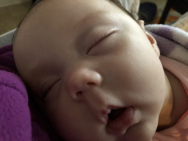 Daylight time ends: Closeup of a soundly sleeping baby's face.