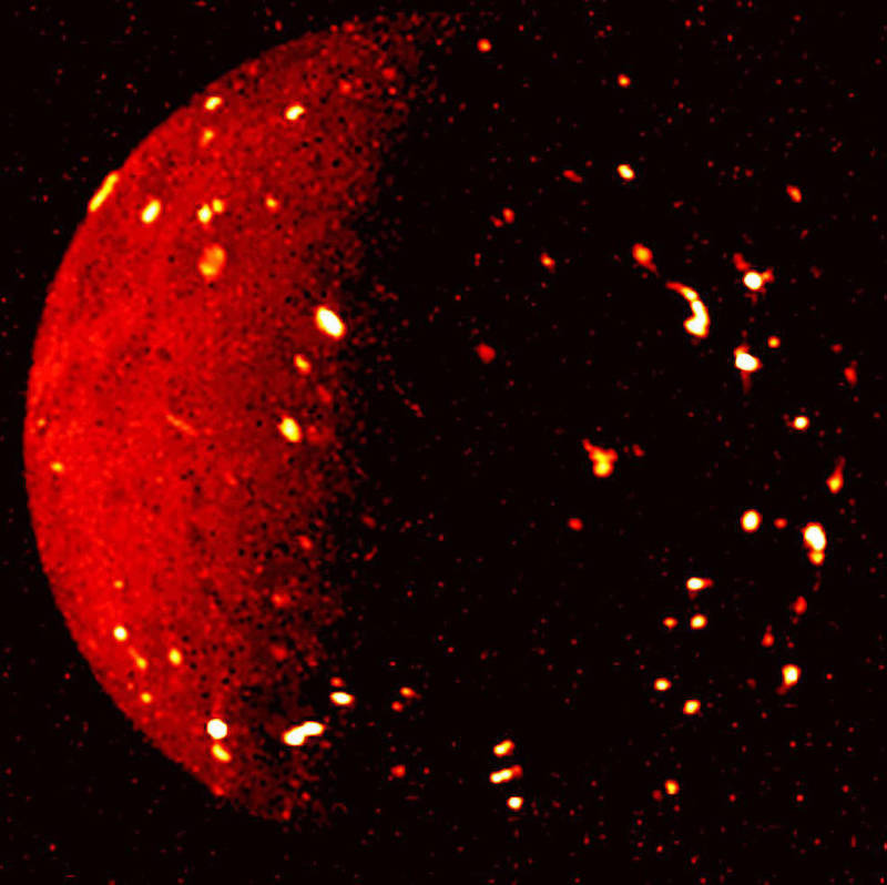 Io: Reddish planet-like object with many bright spots on its surface.