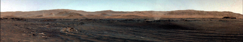 Panoramic image, taken from the ground, of several dust devils moving across Mars' surface.