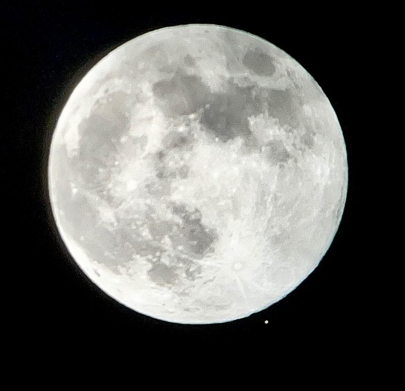 Large white full moon with white dot, Mars, just below it.