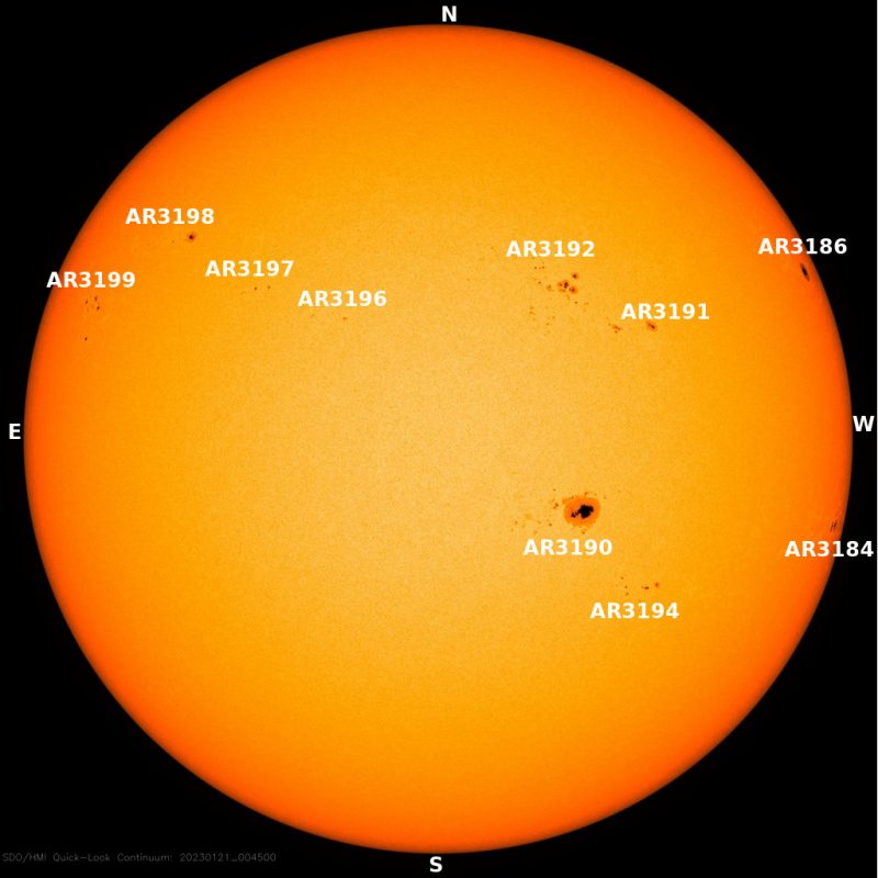 Giant sunspot: The sun, seen as a yellow sphere with dark spots.