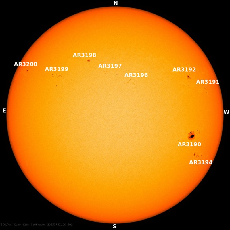 The sun, seen as a yellow sphere with dark spots.